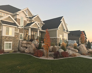 Rock landscaping in front of beautiful house