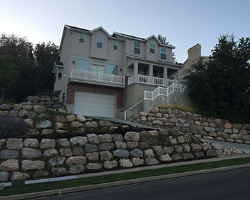 Rock wall in front of house