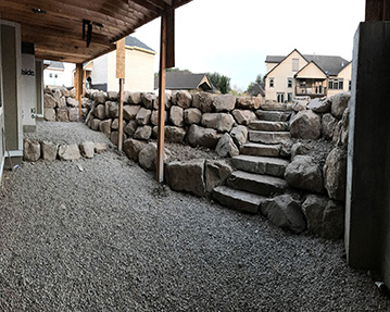 Rock wall and stairs leading out of a basement